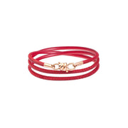 Bracciale Nodo Damiano Parati in oro rosa 9K con cordino in pelle rossa, design elegante e moderno.